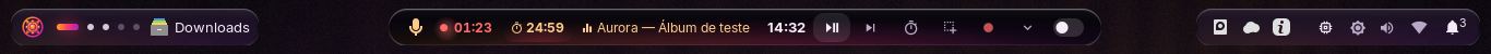 A barra superior em ilhas no tema escuro: o emblema e as mesas à esquerda, a ilha com gravação, cronômetro e música no centro, e os indicadores do sistema à direita.